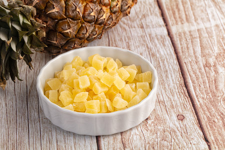 Dry yellow sweet pineapple candy cubesの写真素材