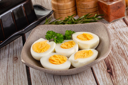 Boiled eggs half with bright yolkの写真素材