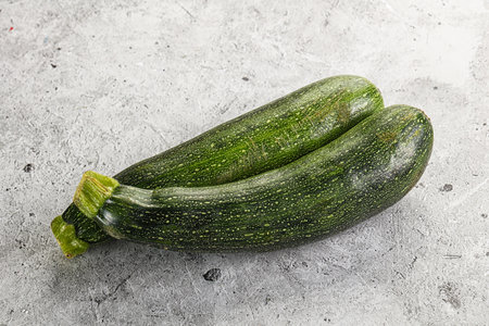 Raw young small green zucchini for cockingの写真素材