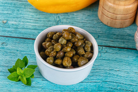 Pickled canned capers snack antipasti in the bowl