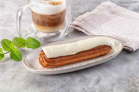 White delicous vanilla eclair with icing dessert