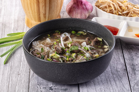 Vietnamese Pho Bo soup with beef and noodles