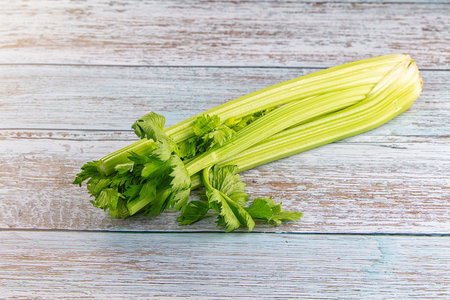 Raw green celery stem with leaves for cooking