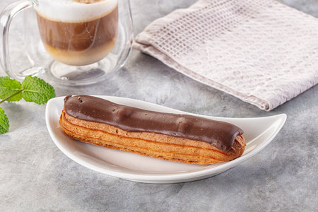 Gourmet chocolate eclair with brown icing