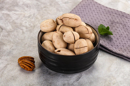 Crunchy pecan nut snack in the bowl