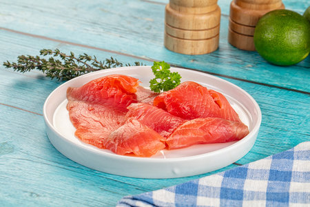 Delicous sliced salmon fillet ready to eat in the plate served thymeの写真素材