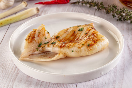 Fresh grilled calamari protein with herbs