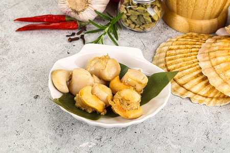 Delicous luxury baked seafood scallops in the plate