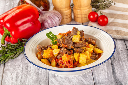Homemade Rogiut with meat, potatoes and tomatoesの写真素材