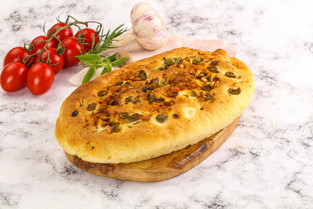 Homemade ciabatta bread with olives and rosemaryの写真素材