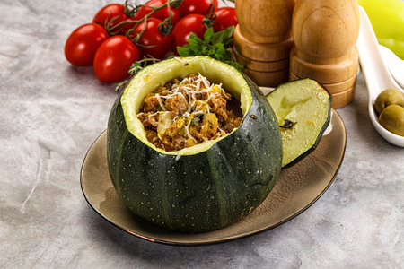 Baked round zucchini with meat and vegetablesの写真素材