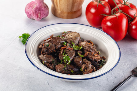 Roasted chicken liver with green onion and spicesの写真素材