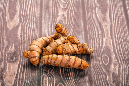 Fresh raw asian tumeric roots heapの写真素材