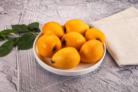 Ripe sweet juicy medlar fruit heapの写真素材