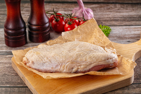 Raw duck breast fillet for cooking ovet boardの写真素材