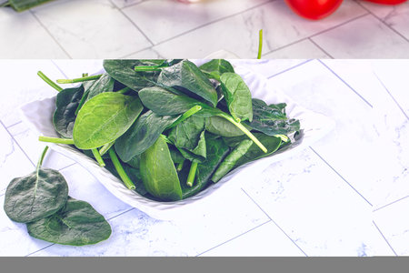 Raw fresh green spinach leaves in the bowl