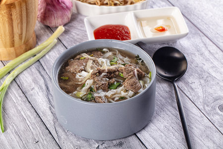 Vietnamese Pho Bo soup with beef and noodles