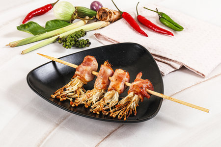 Thai Street food satay with bacon and mushroom enoki skewerの写真素材