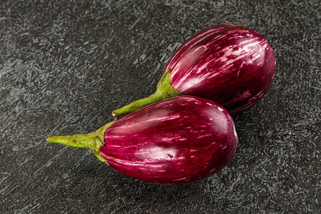 Ripe raw mini violet eggplant for cookingの写真素材