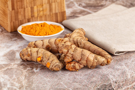 Fresh aroma turmeric roots heap served powderの写真素材