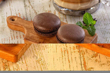 Sweet tasty almond dessert - chocolate macaroon with coffeeの写真素材