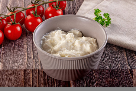 Italian delicous stracciatella young soft cheese in the bowlの写真素材