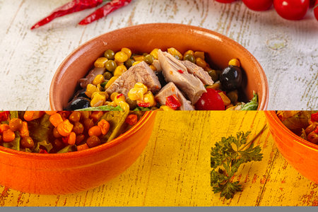 Dietary salad with canned tuna, peas, tomato and cornの写真素材