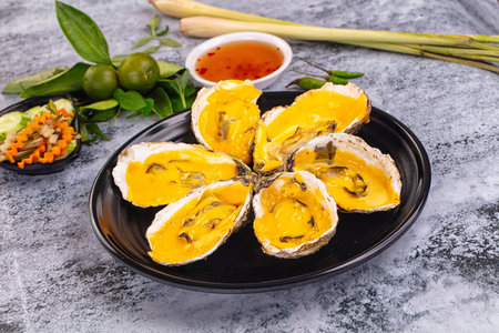 Baked hot oyster with cheddar cheese