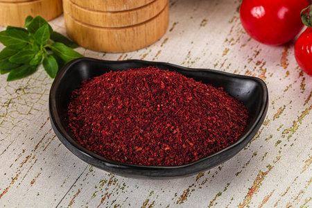 Natural organic Sumah powder for culinary in the bowl