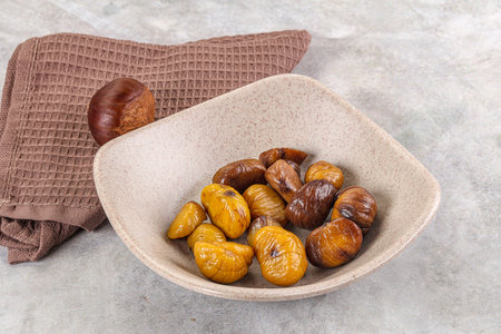 Roasted sweet natural organic shestnut in the bowlの写真素材