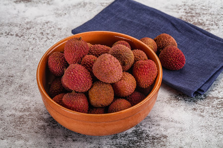 Sweet juicy tropical fruit lychee heap in the bowl