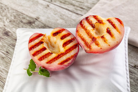 Sweet juicy grilled peaches dietary dessertの写真素材