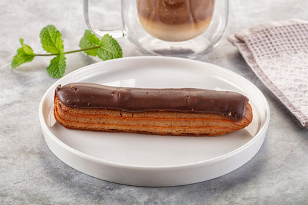 Gourmet chocolate eclair with brown icing