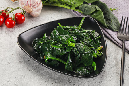 Cocked green spinach garnish with oilの写真素材