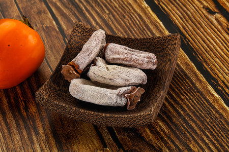 Dry sweet ripe persimon fruit dessertの写真素材