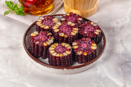 Ripe boiled black corn maize garnishの写真素材