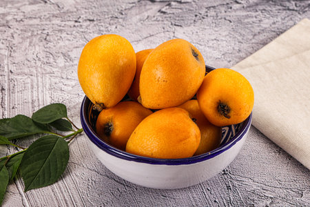 Ripe sweet juicy medlar fruit heap