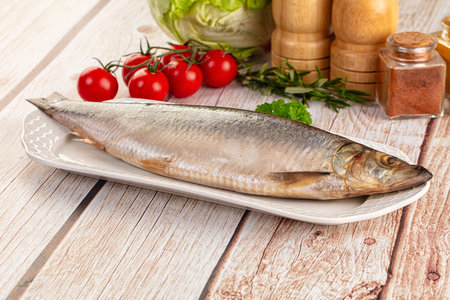 Raw whole salted herring fish served parsleyの写真素材