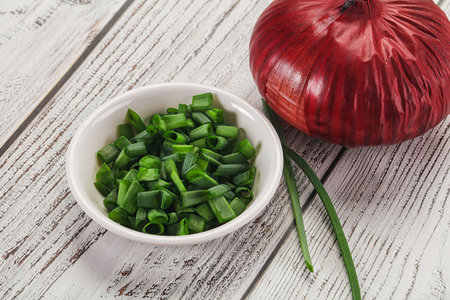 Diced fresh green onion in the bowlの写真素材