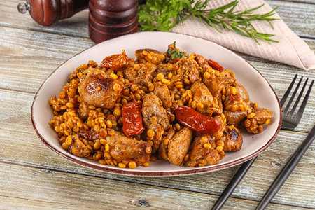 Raised chicken meat with ptitim and vegetablesの写真素材