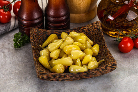 Turkish traditional marinated mini yellow chili peppersの写真素材