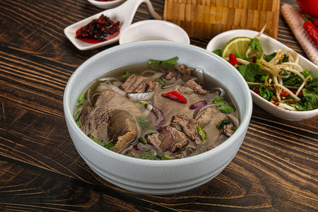 Vietnamese Pho Bo soup with beef, noodles, cilantro and spices