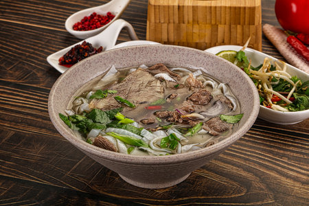Vietnamese Pho Bo soup with beef, noodles, cilantro and spicesの写真素材
