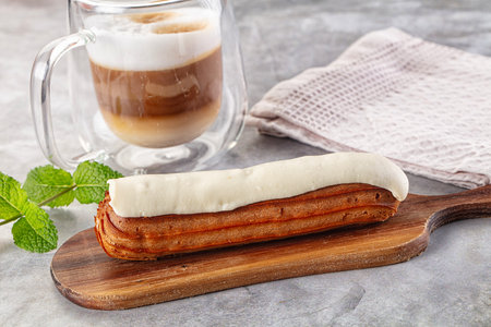 White delicous vanilla eclair with icing dessert