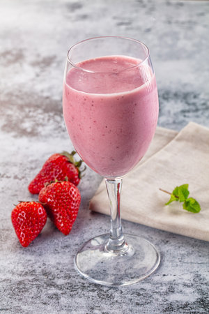 Sweet and cold Strawberry smoothie milk shake glassの写真素材