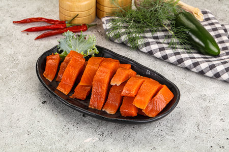 Red pickled herring fish fillet served dill