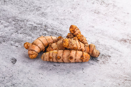 Fresh raw asian tumeric roots heapの写真素材