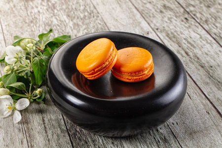 Sweet almond cookies orange macaroons served flowerの写真素材