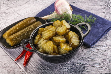 Sliced marinated cucumbers in the bowl snackの写真素材