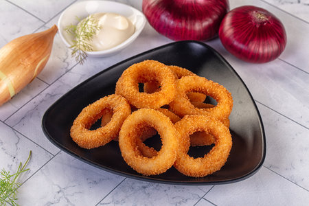 Golden fried breaded onion rings snackの写真素材